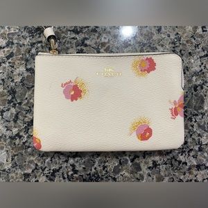 Floral cream colored Coach wristlet